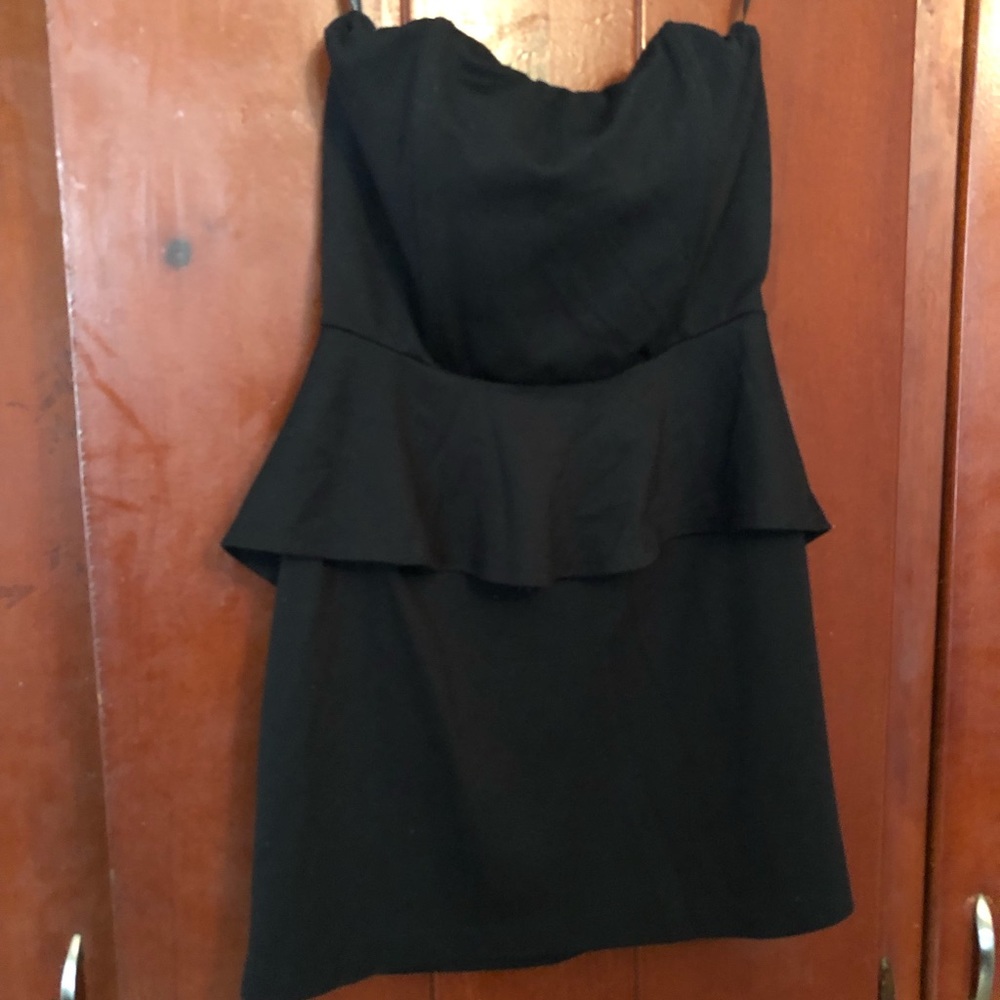 Black peplum dress. Foreign exchange. Size large.